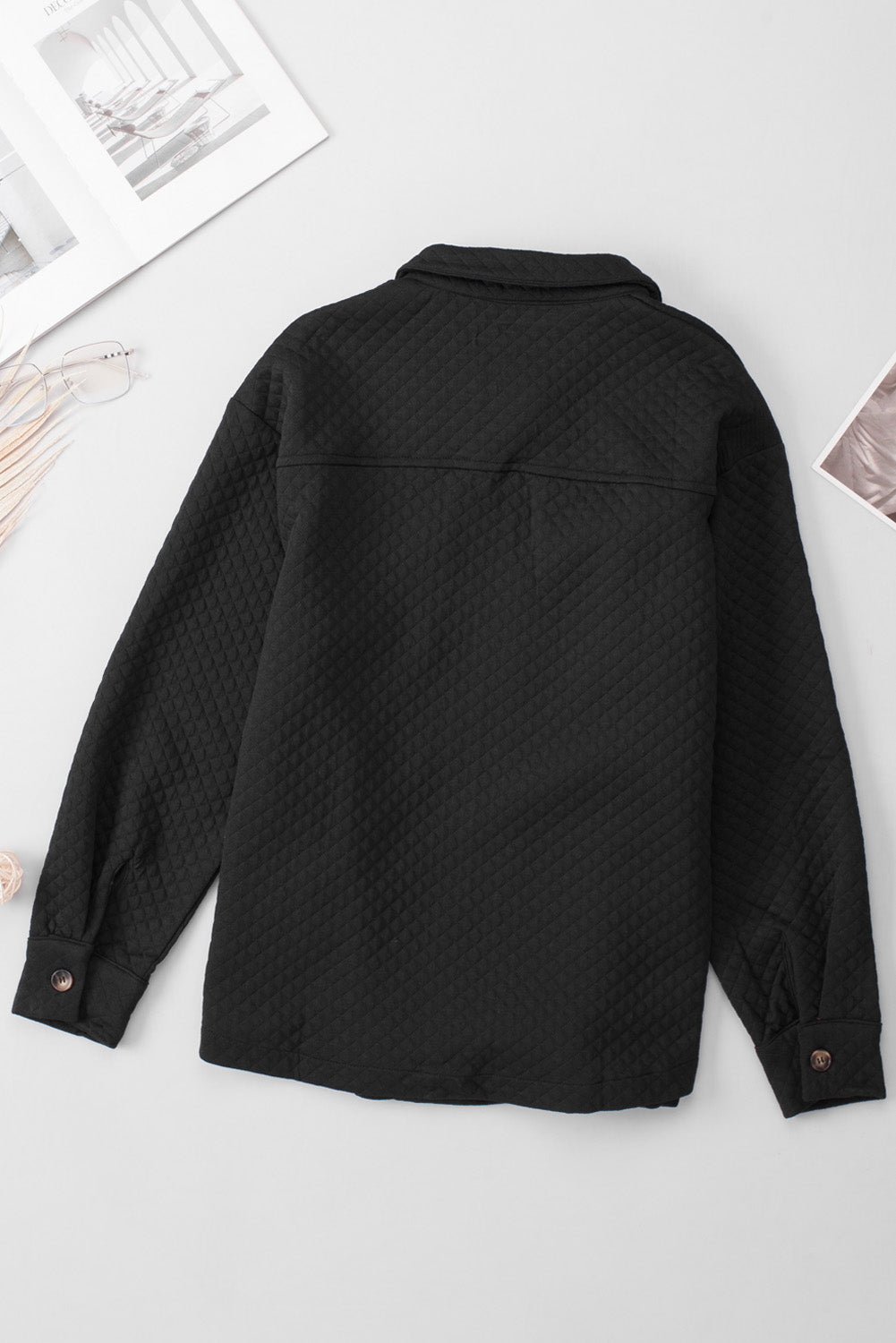 Black quilted overshirt with button cuffs and collar