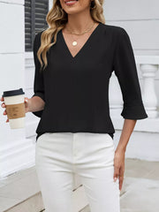 Black V-neck blouse with 3/4 sleeves featuring lace trim on the cuffs.