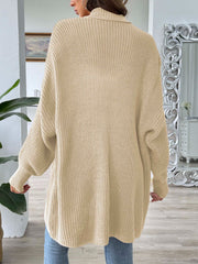 Tan ribbed knit cocoon cardigan with a relaxed fit and balloon sleeves.