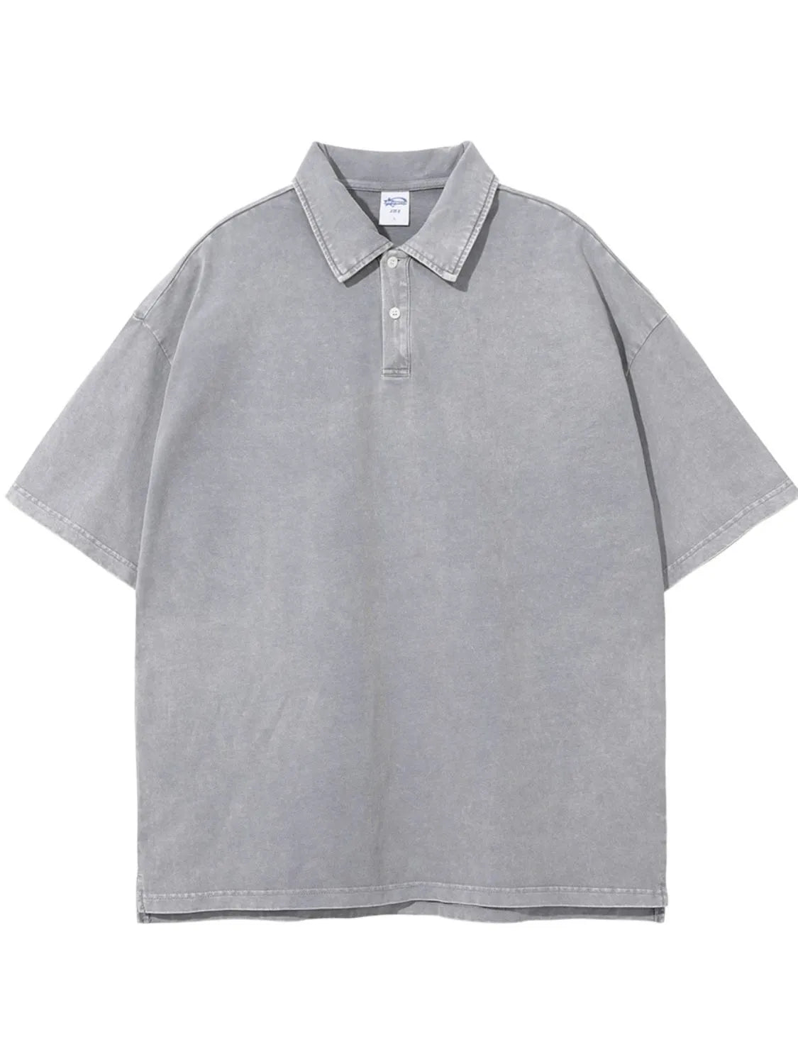 Oversized gray washed polo shirt with a relaxed fit and short sleeves.