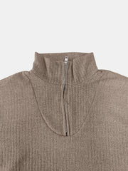 Ribbed knit quarter-zip pullover sweater in taupe with a mock neck and silver zipper detail.