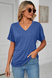 Royal blue v-neck tee with short dolman sleeves and ruched side detail.