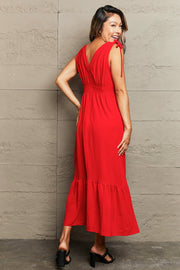 Red polyester midi dress with empire waist, V-neck, tie straps, and tiered hem.
