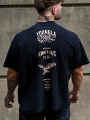Black graphic tee with raw edges, rose and eagle print, and "Young Ambitious Club" text.