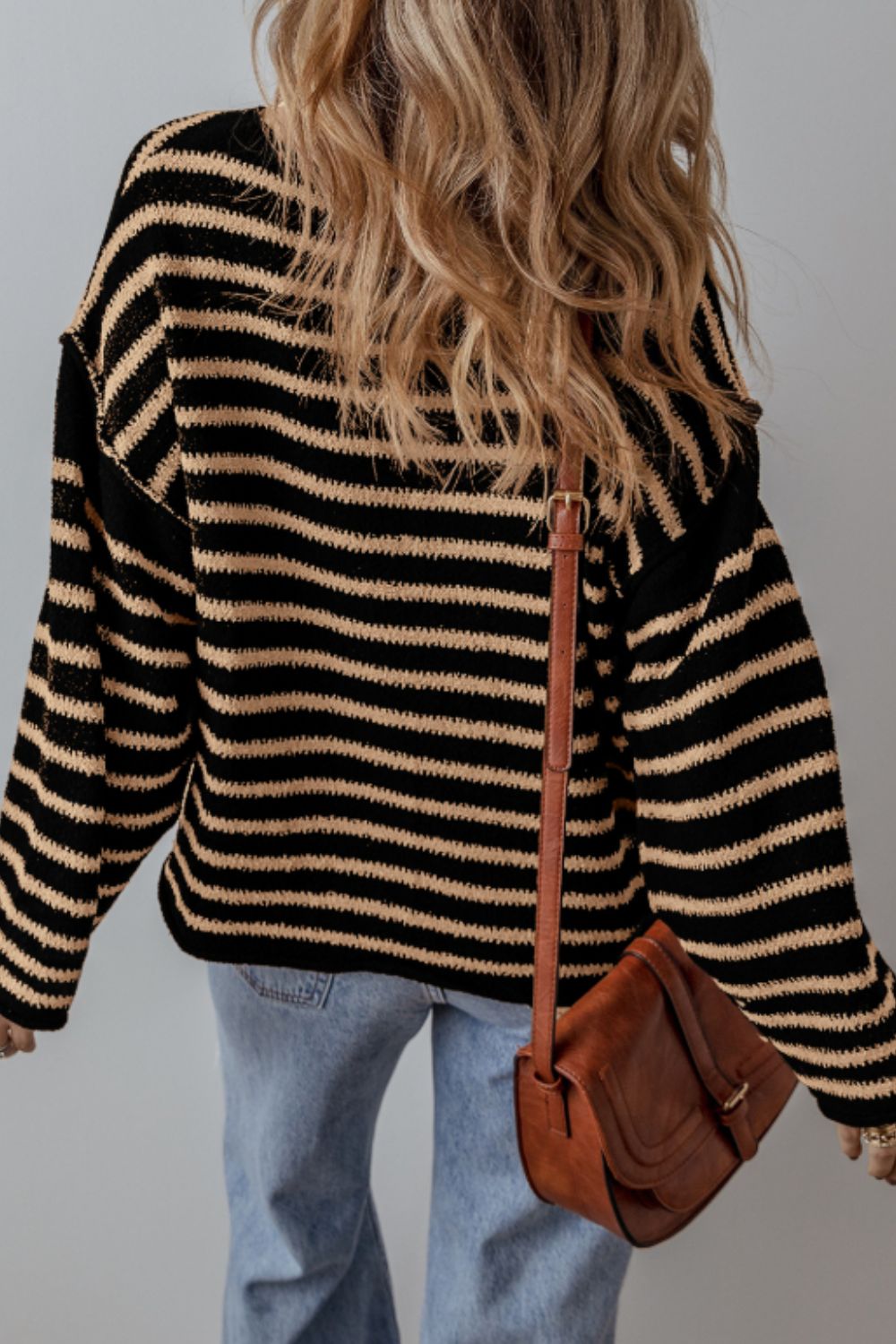 Black horizontal stripe slouchy knit jumper with a relaxed fit.