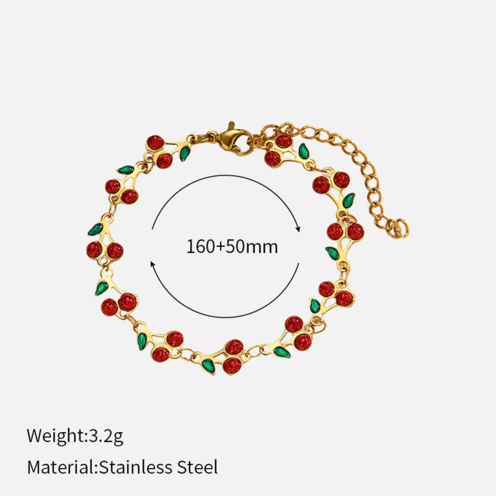 Gold-plated bracelet with red cherry cluster charms and green leaves, adjustable length