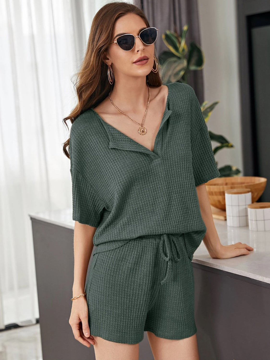 Army green waffle knit henley short set with drawstring shorts and short sleeves.