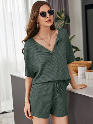 Army green waffle knit henley short set with drawstring shorts and short sleeves.