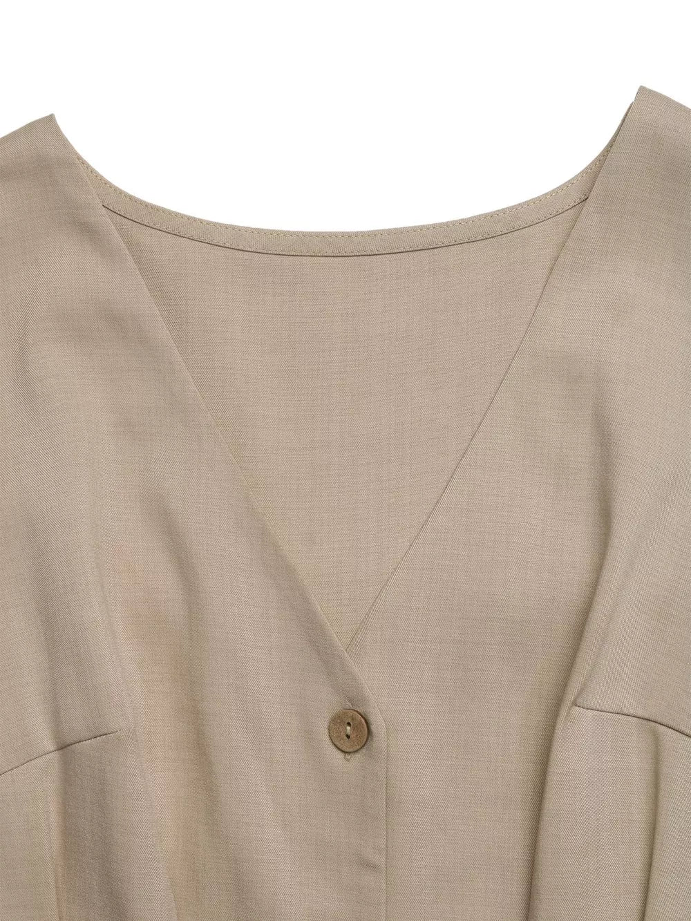 V-neck romper in beige with button detail and pocket detail