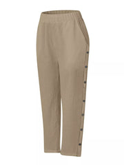 Khaki relaxed fit pants with decorative side buttons and elastic waist