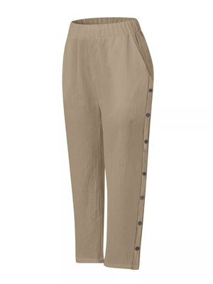 Khaki relaxed fit pants with decorative side buttons and elastic waist