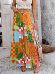 Geometric print wide-leg trousers with drawstring waist in multicolor.