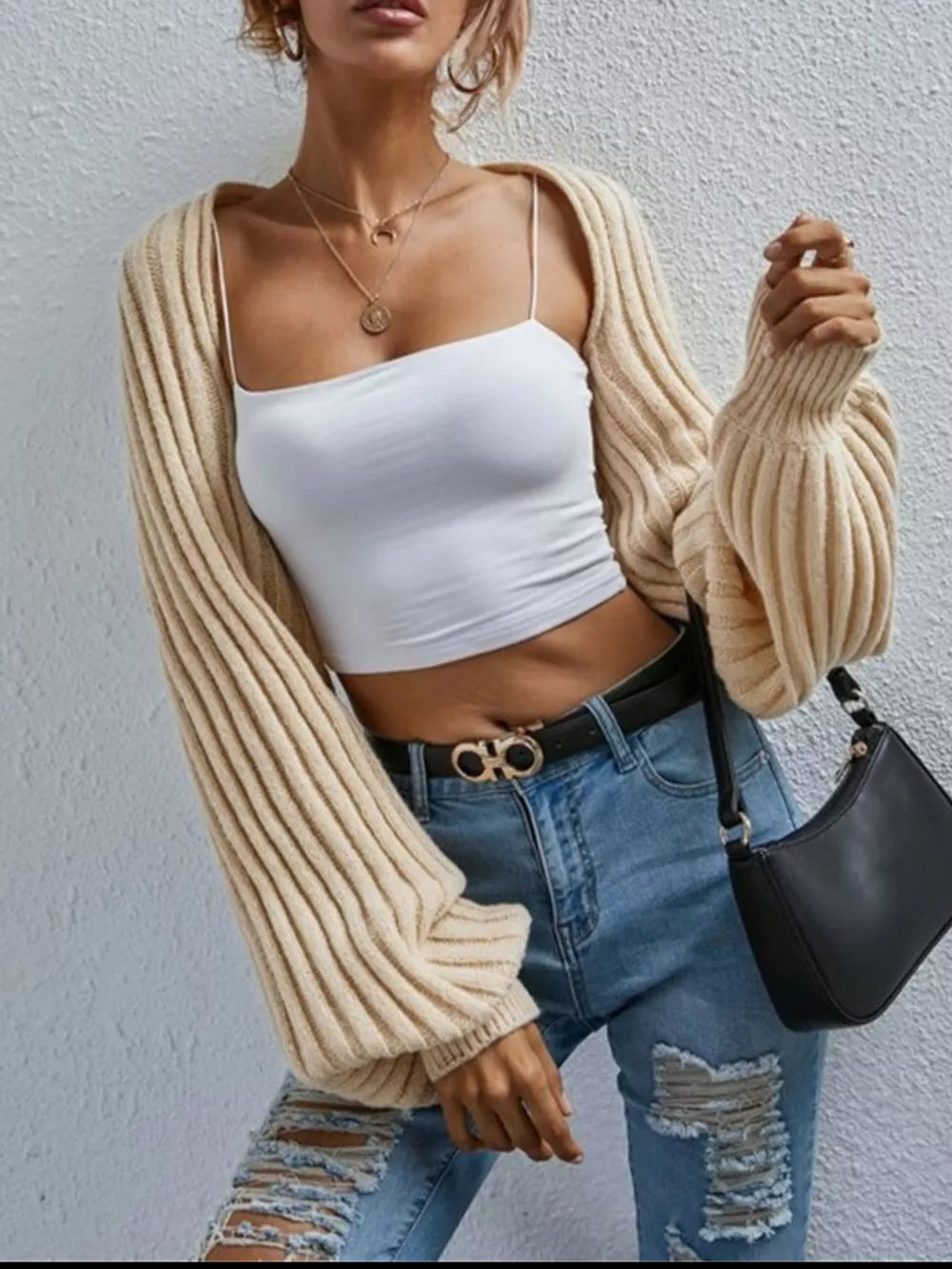 Beige balloon sleeve cropped knit cardigan with ribbed texture and wide cuffs.