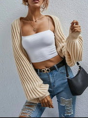 Beige balloon sleeve cropped knit cardigan with ribbed texture and wide cuffs.