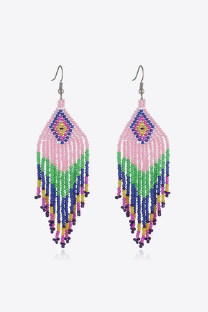 Beaded diamond fringe earrings in pink with multicolor bead strands and boho style.