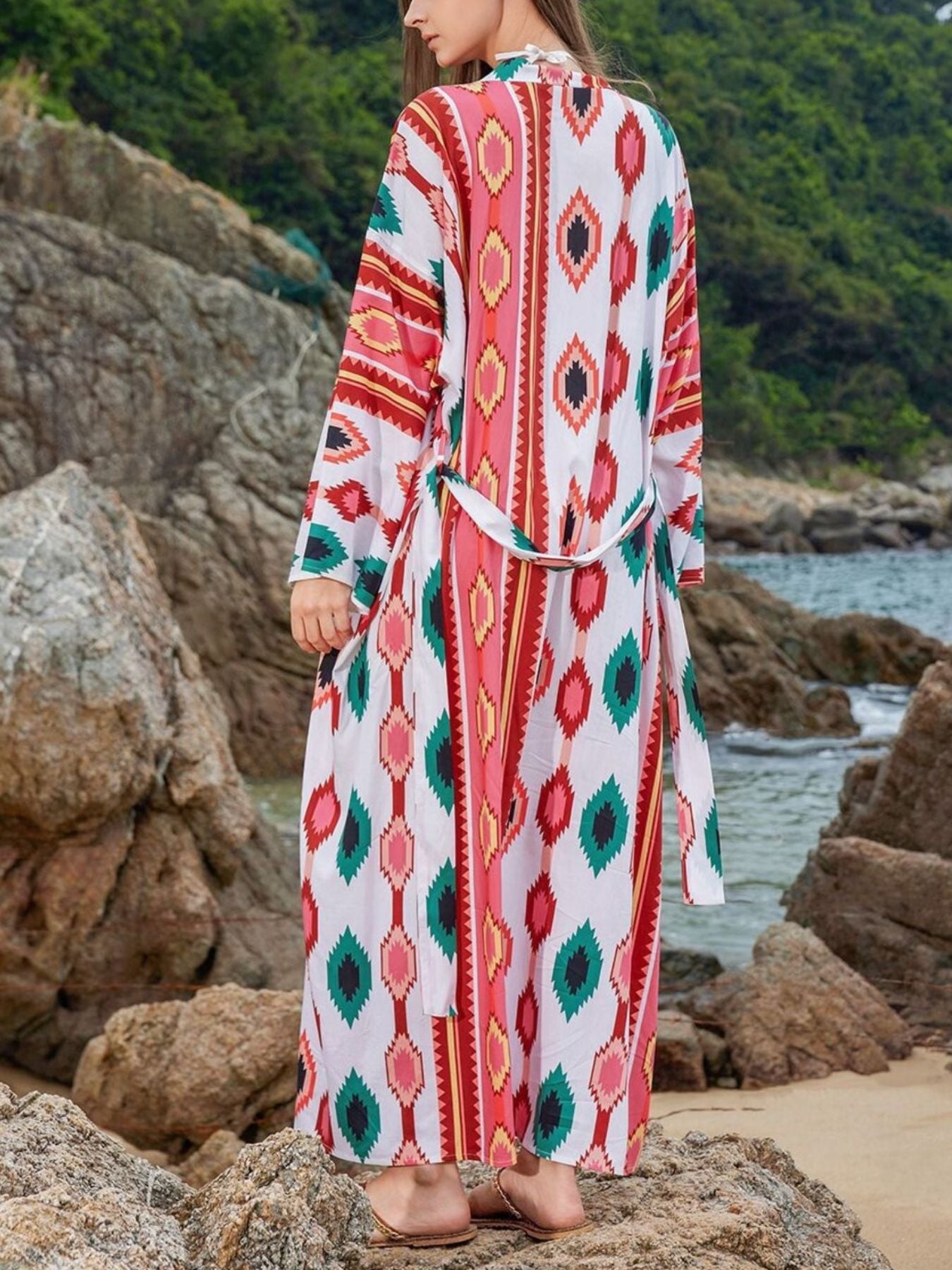 Boho print maxi beach cover-up with a tie waist and long sleeves.