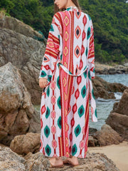 Boho print maxi beach cover-up with a tie waist and long sleeves.