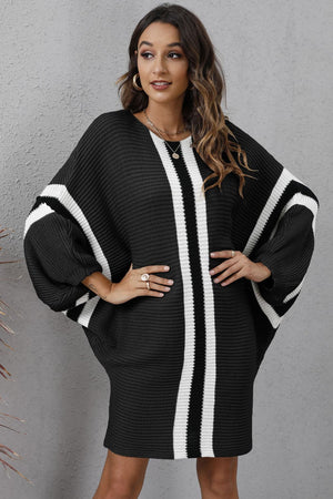 Black oversized knit cocoon dress with white stripes and balloon sleeves.