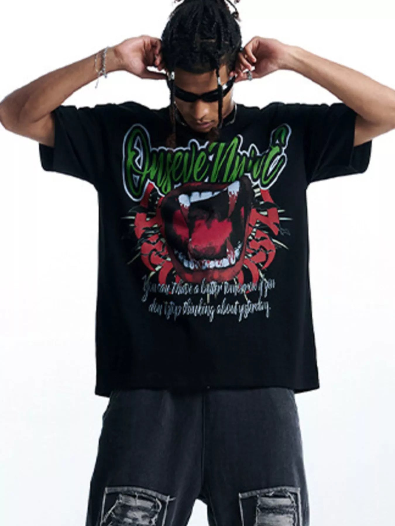 Black 100% cotton oversized t-shirt with bold graphic print of mouth and text.