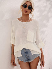 Ivory relaxed knit tunic top with boat neck and chest pocket, cuffed sleeves.