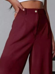Burgundy high-waisted pleated wide-leg maternity trousers with button detail.
