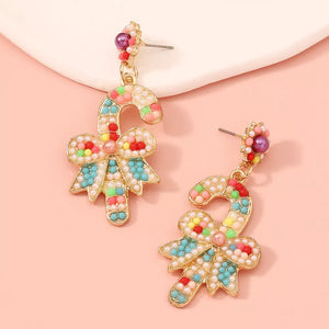 Festive candy cane bow earrings with colorful beads and pearl accents.