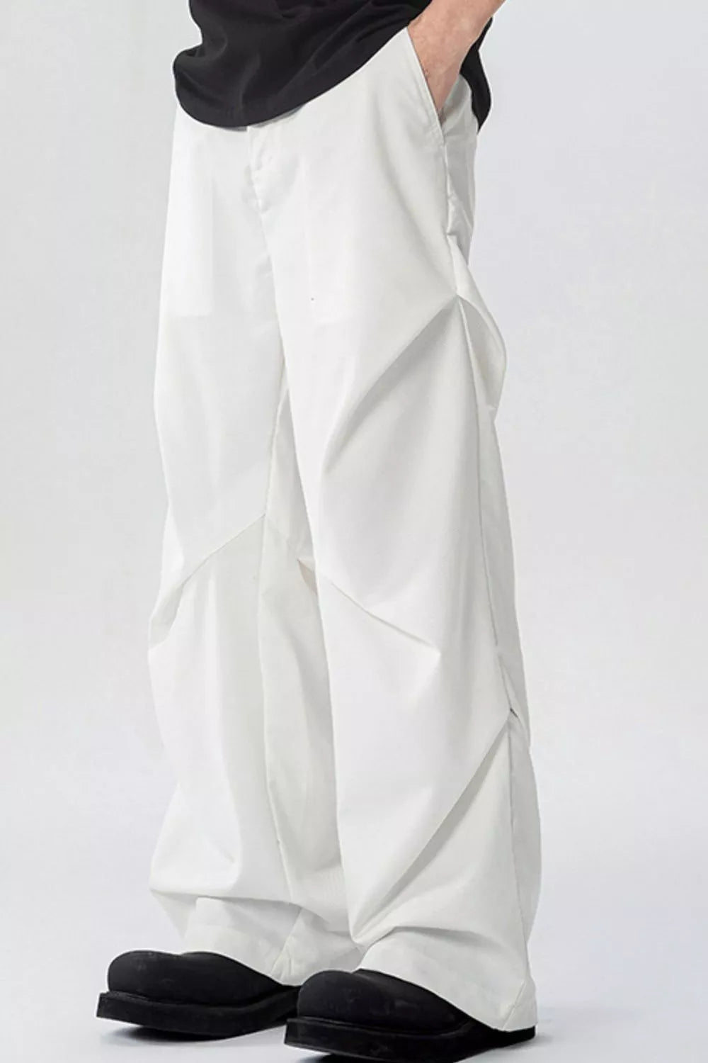 White men's wide-leg sweatpants with pockets and a relaxed fit.
