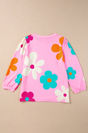 Pink long sleeve t-shirt with a retro floral print and puff sleeves.