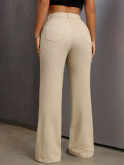 High-waisted flare denim trousers in tan with buttoned closure and back pockets.