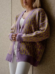 Geometric knit button-up cardigan in dusty pink with yellow pattern, acrylic, V-neck, long sleeves.