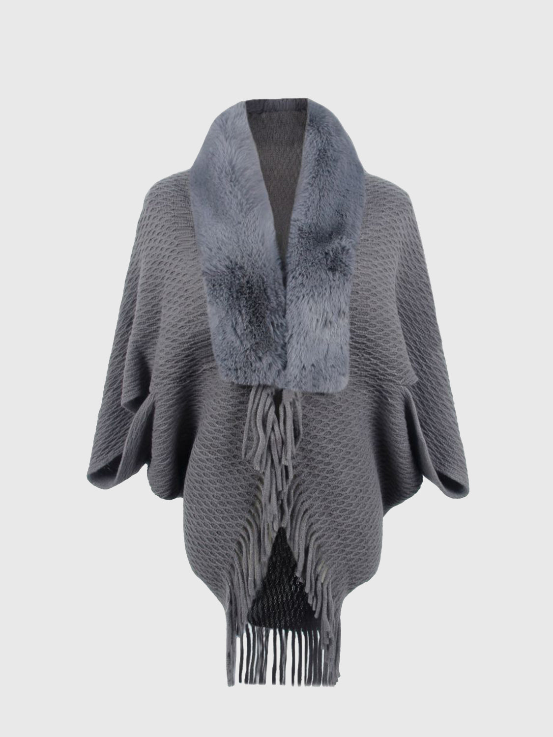 Textured knit poncho in charcoal with faux fur collar and fringe detail