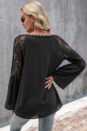Black lace sleeve blouse with scallop trim neckline and bell sleeves.