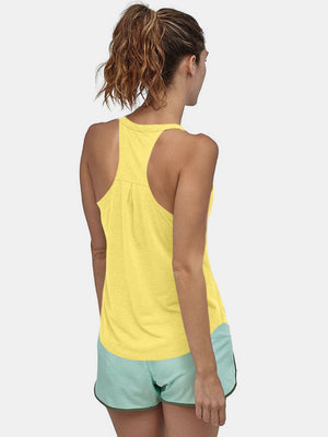 Yellow racerback performance tank top with pleats on the back.