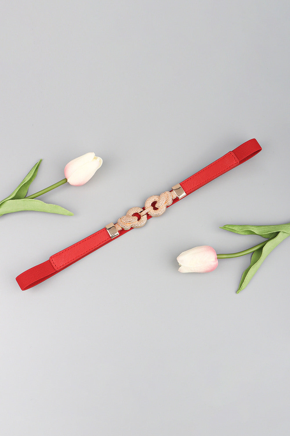 Red elasticated waist belt with linked knot alloy buckle detail