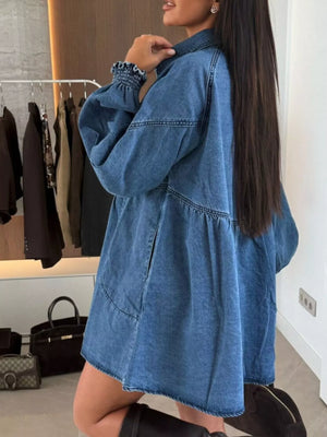 Blue denim mini dress with pockets and ruffled cuffs.