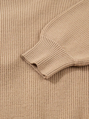 Ribbed knit sweater dress in beige with a close-up view of the sleeve cuff detail.