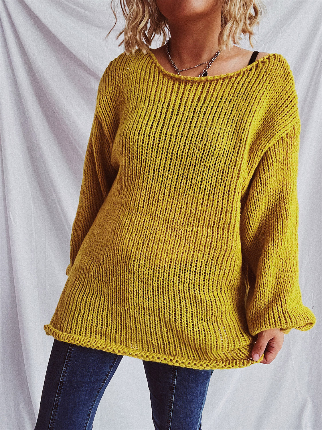 Mustard open-knit slouchy boatneck pullover sweater with relaxed fit and ribbed hem.