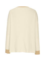Waffle knit raglan sleeve sweatshirt in cream with tan cuffs and neckline detail.