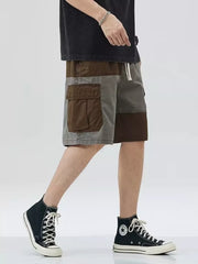 Two-tone cargo shorts with drawstring and patch pockets, above knee length.