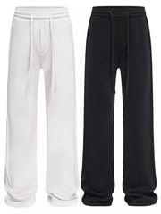 Relaxed fit drawstring casual pants in light gray and black with a cotton blend material.