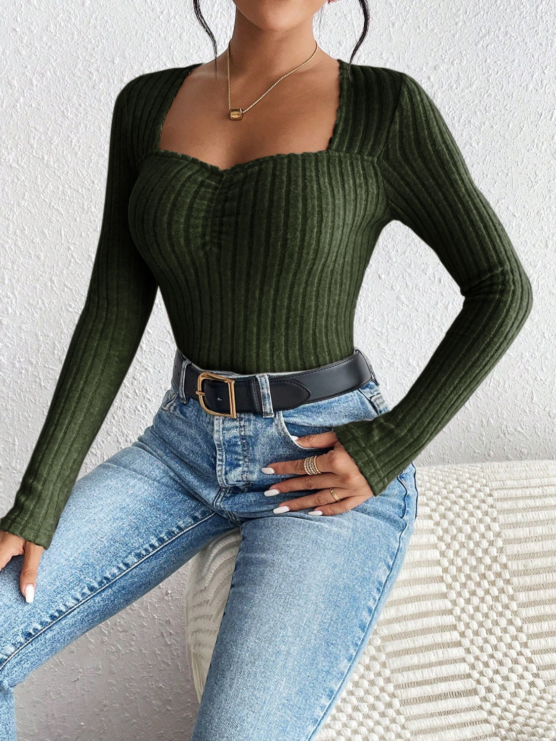 Army green ribbed bodysuit with sweetheart neckline and long sleeves.