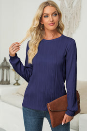 Navy crewneck pullover with textured vertical waves and long sleeves.