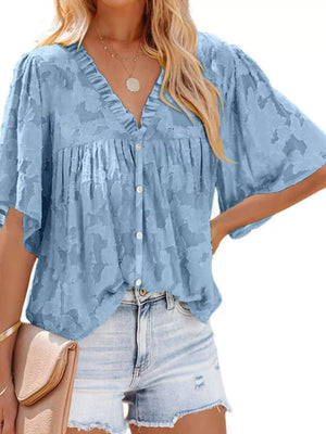 Blue textured V-neck button-down blouse with ruffled detail and flutter sleeves.