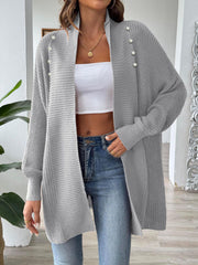 Gray ribbed knit cardigan with pearl buttons and open front.