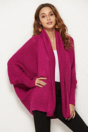 Cocoon knit cardigan in deep purple with shawl collar and batwing sleeves.