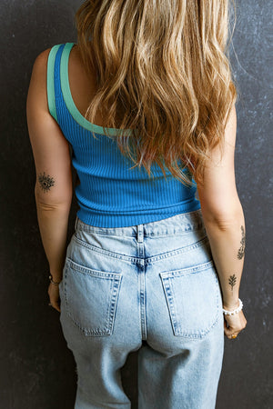Sky blue ribbed tank top with contrast trim neckline and armholes.
