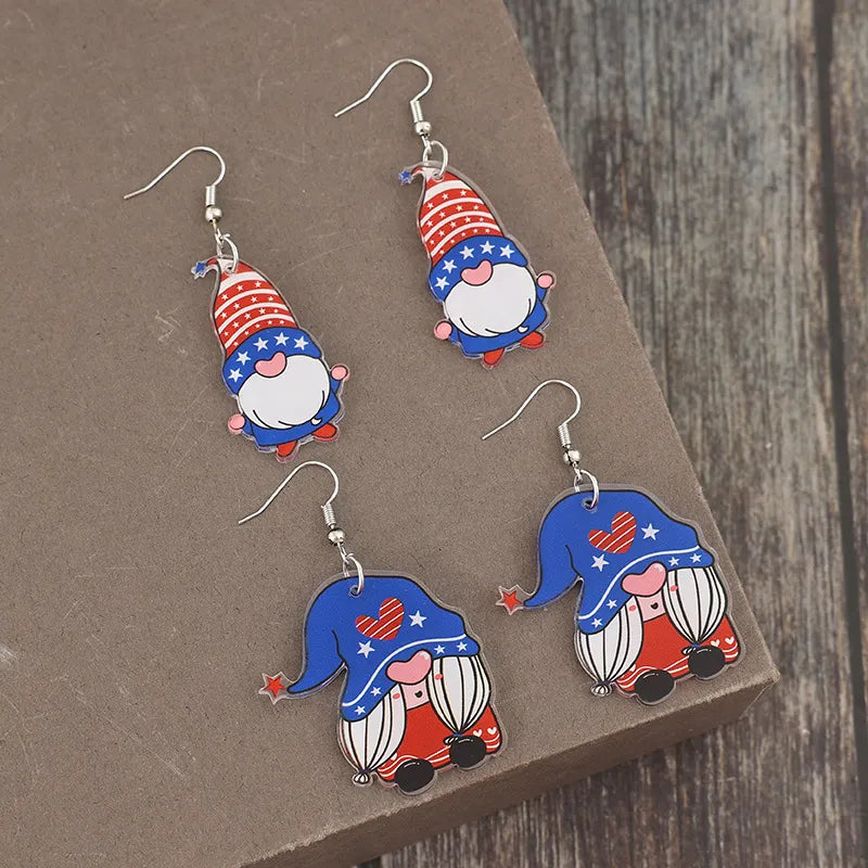 Patriotic gnome acrylic dangle earrings in royal blue with stars and stripes design.