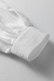 White crinkled texture shirt with lantern sleeve detail and button cuff