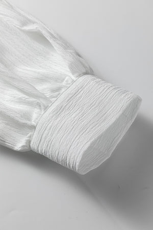 White crinkled texture shirt with lantern sleeve detail and button cuff