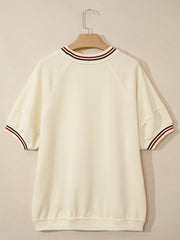Beige cotton tunic top with striped neckline and sleeve cuffs.